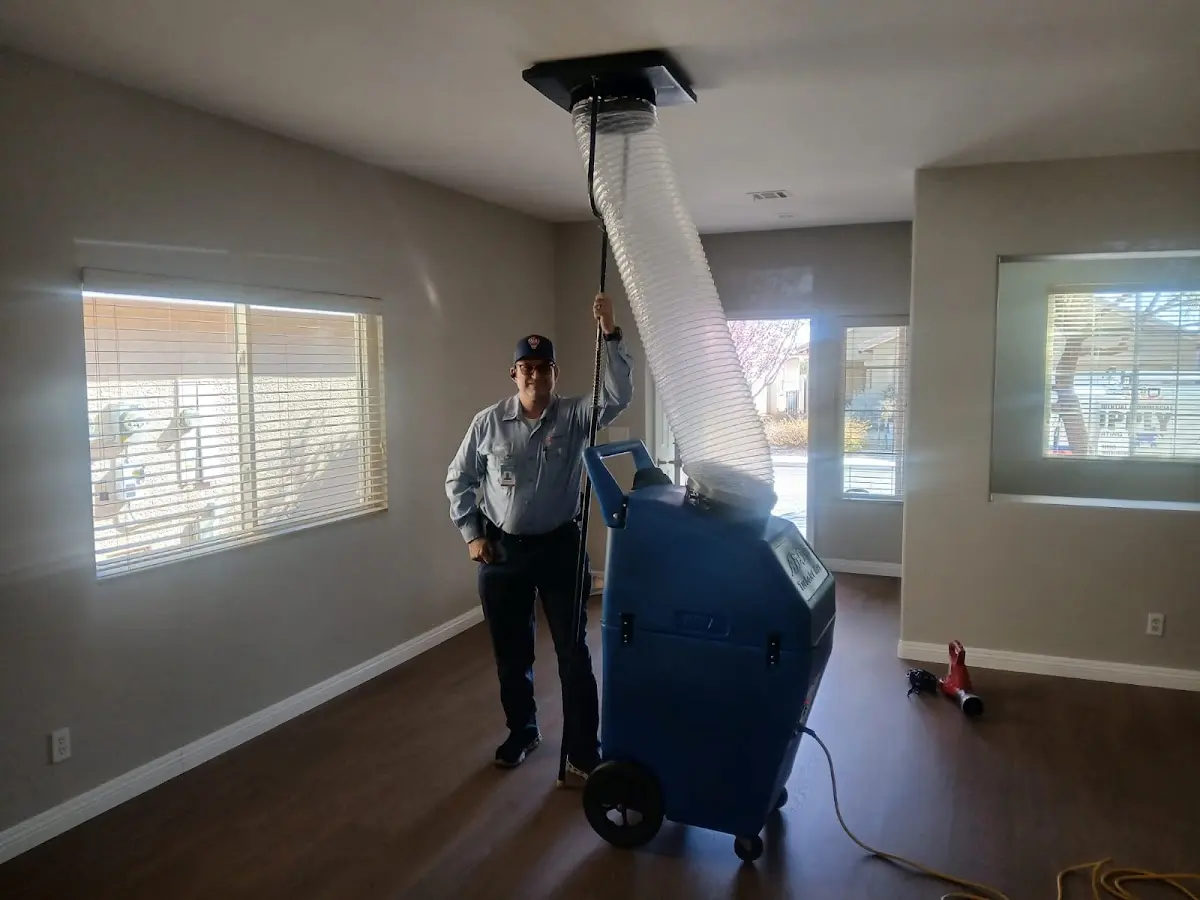 Professional Dryer Vent Cleaning work inside a Mecca home